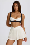 Soft Active Crossover Pleated Mini Skort in Coconut