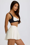 Soft Active Crossover Pleated Mini Skort in Coconut
