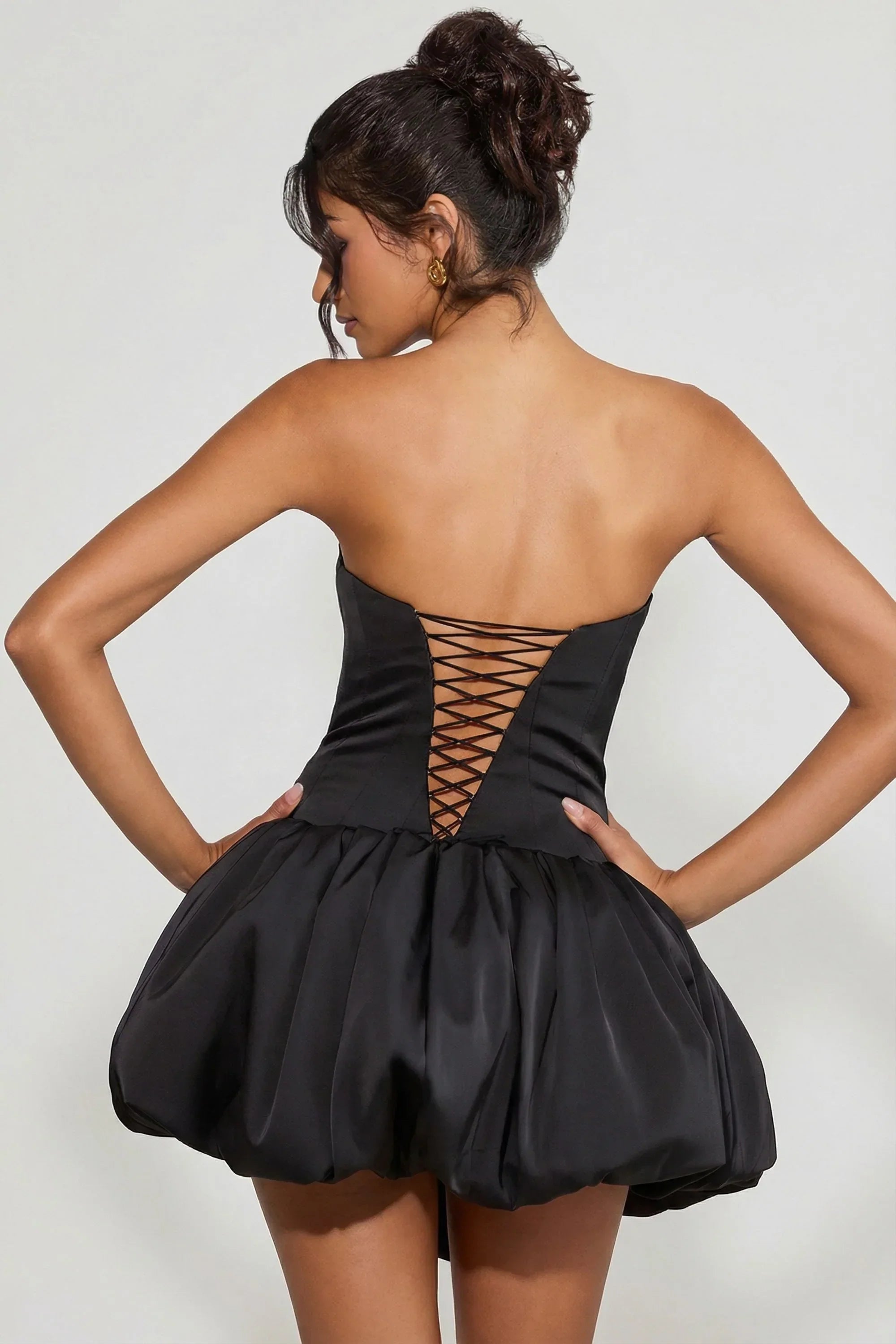 Lace Up Bubble Hem Corset Micro Mini Dress in Black