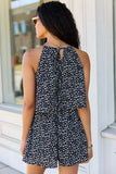 Spotlight Moment Black and White Daisy Print Halter Neck Romper