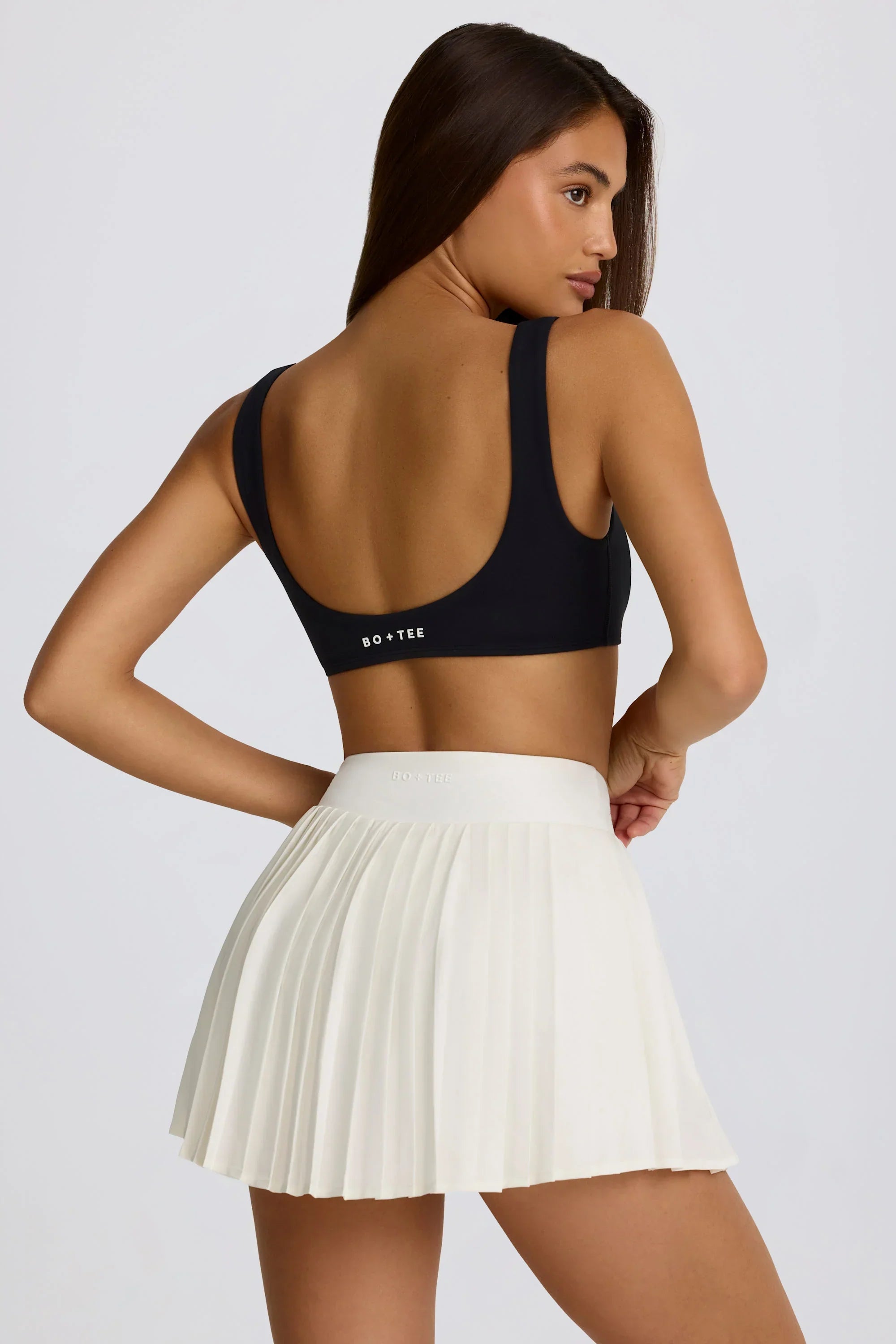 Soft Active Crossover Pleated Mini Skort in Coconut