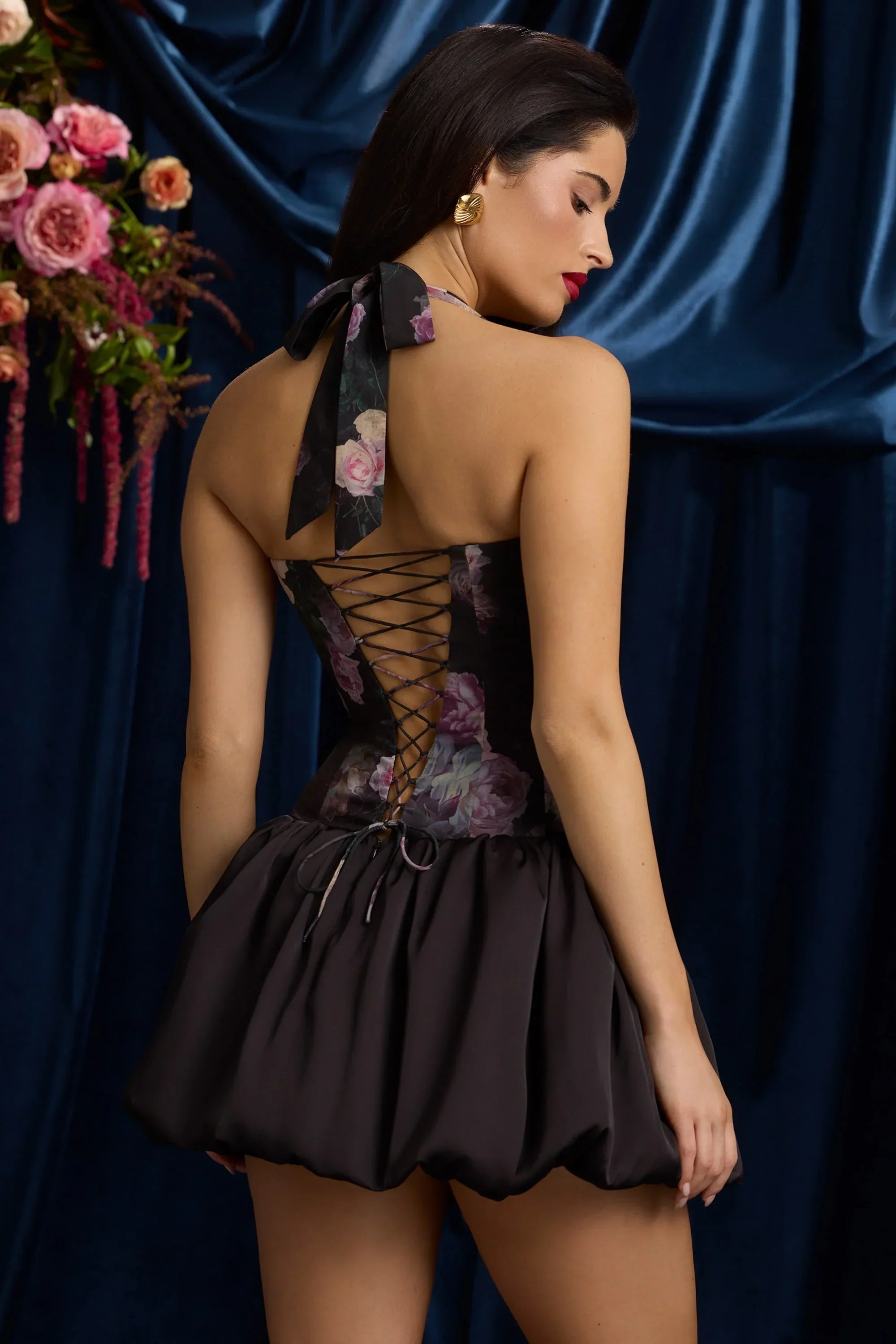 Halterneck Lace Up Bubble Hem Mini Dress in Black Floral Print