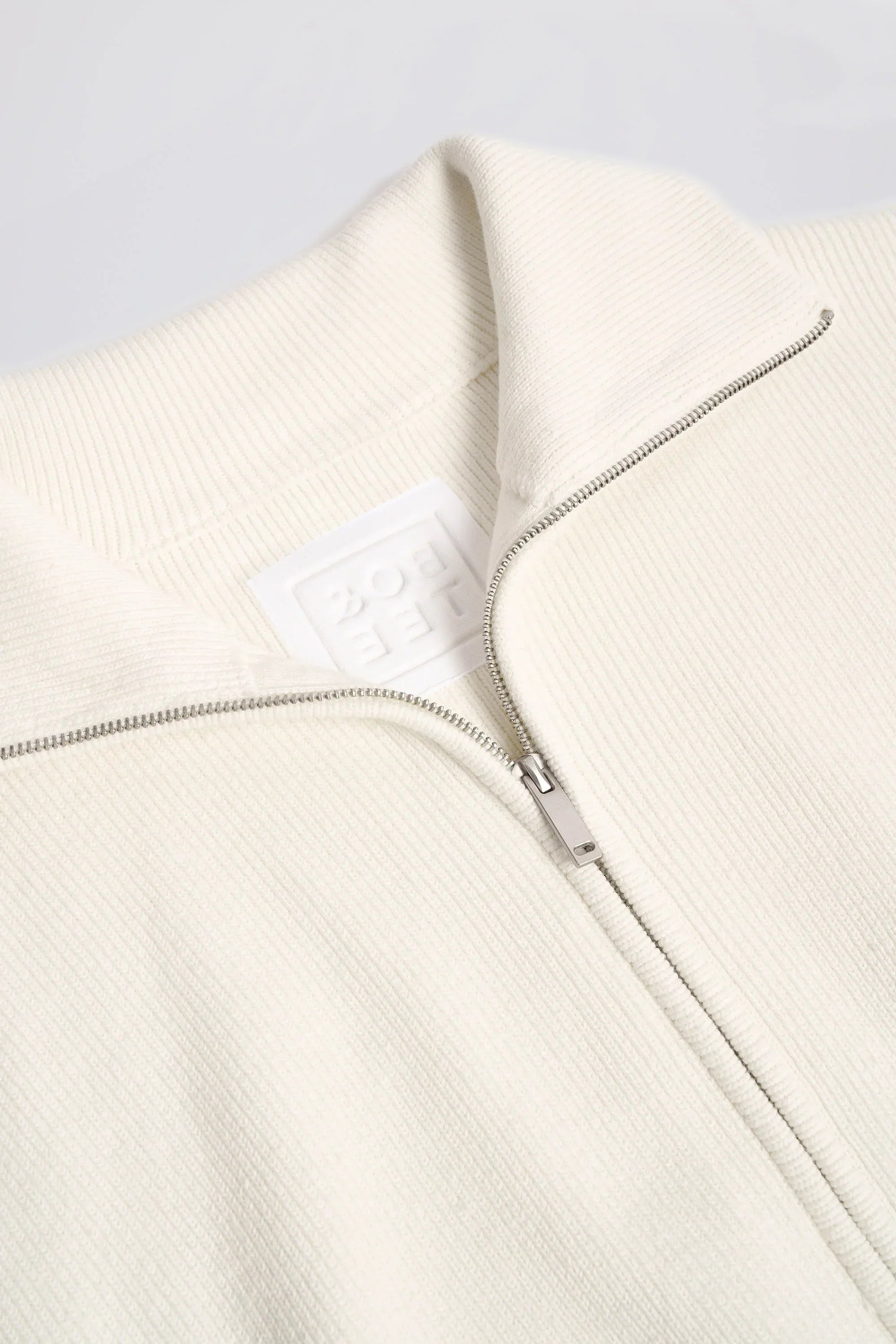 Ribbed Knit Zip Up Cropped Sweatshirt in Ivory