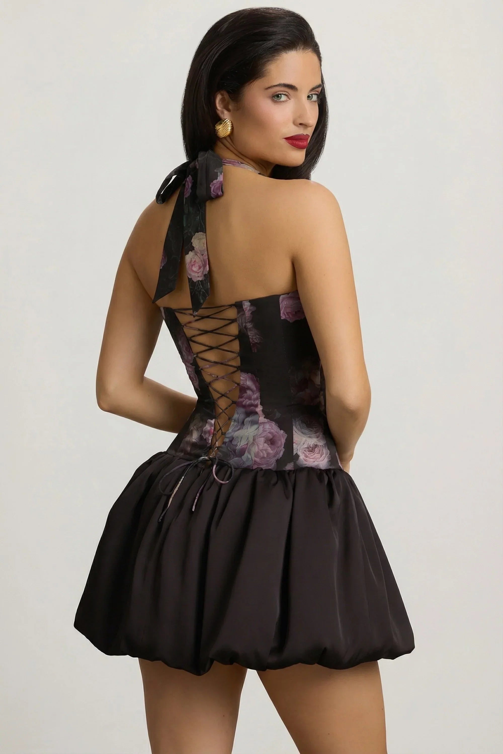 Halterneck Lace Up Bubble Hem Mini Dress in Black Floral Print